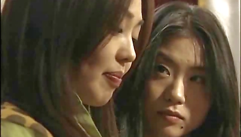 Aged Asian lesbian fucking her younger gf in her pussy