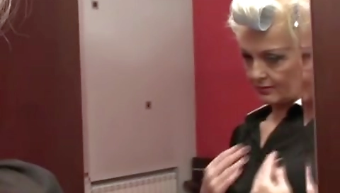 Perverted granny masturbates on the bed